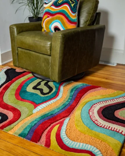 Handmade Abstract Rug showcases abstract pattern with freeform curves. Whether you're looking to add a splash of color, adorn your OEKO-TEX